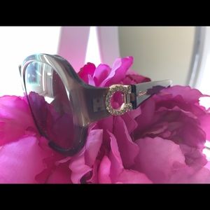 Salvatore Ferragamo sunglasses.